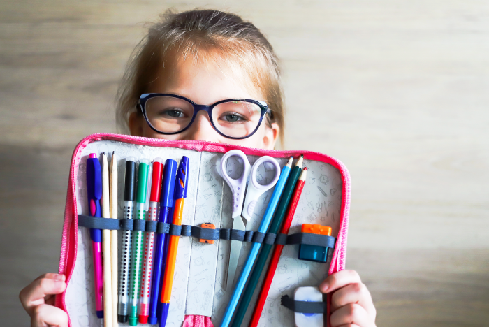 Girl holding up a fully stocked pencilcase